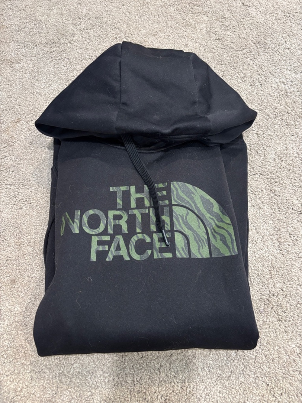 The North Face Black Hoodie with Green Patterned Logo